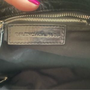 This classic Balenciaga black bag can be dressed up or down.